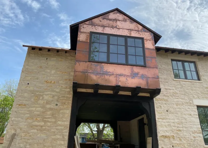 Copper metal panel facade on a stone building for Metal Roof Coating in Allen Park